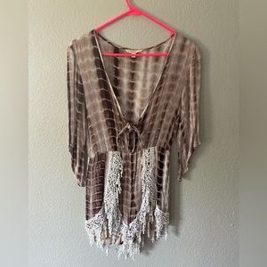 3/4 length sleeve, tie romper with lace detail.